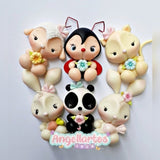 Figuras de animalitos en porcelana fría realizadas con molde Coelho y Cía de Angela Moldes, conejos y personajes infantiles para toppers y decoración.